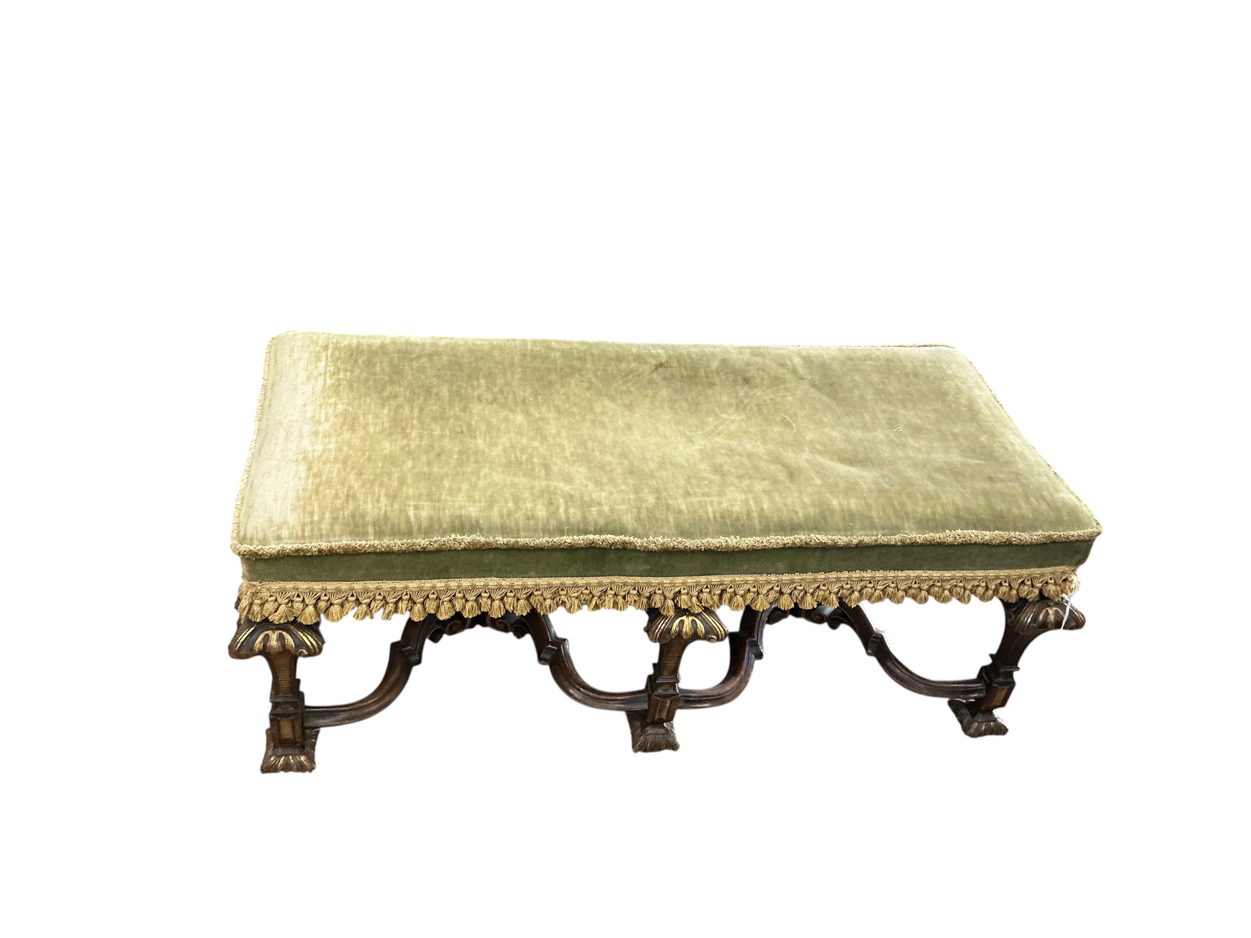 An 18th century style upholstered parcel gilt walnut stool, width 110cm, depth 48cm, height 44cm